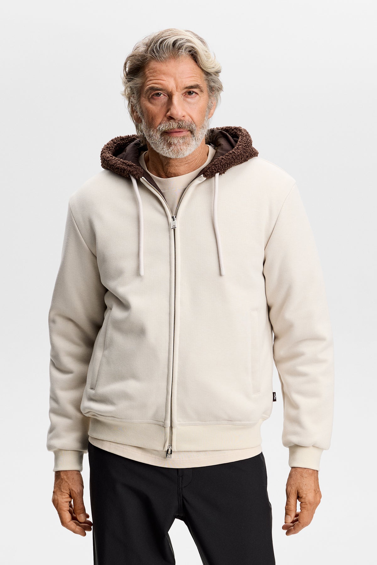 Front view: Model wearing the Henry Bonded Hoodie in Moonbeam with a full-zip front and drawstring hood.