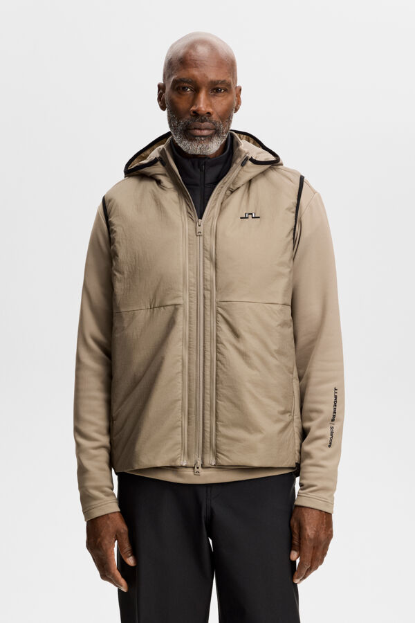 Model wearing the M Solarcore 3 in 1 Jacket in Brindle with a hood and chest Bridge logo.