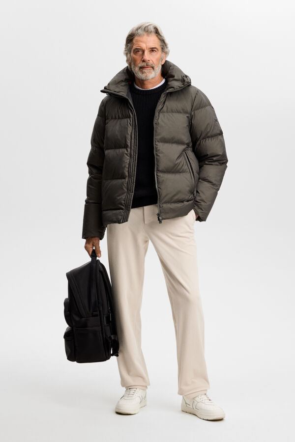 Model wearing the Daryl Crinkle Down Jacket in Chimera, full-body view in a studio setting.