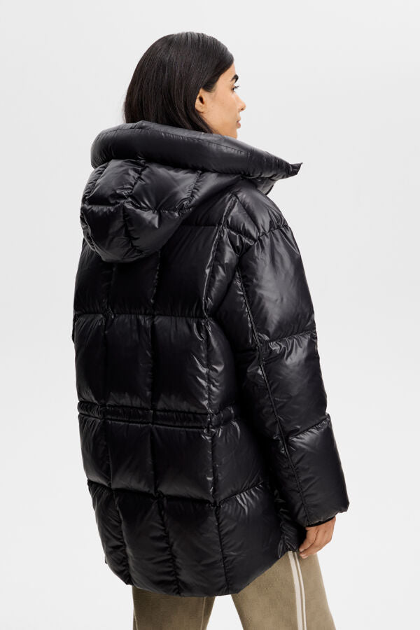 Three-quarter back view of the black Tranquil Down Jacket, featuring a padded hood and quilted panels.