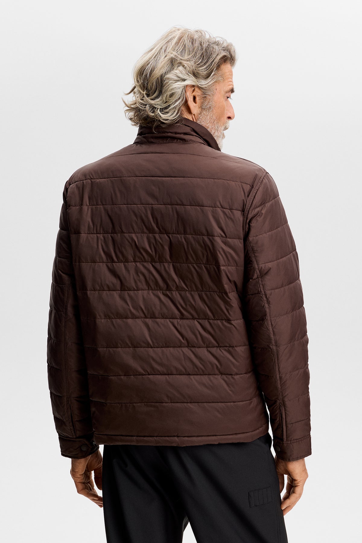 Back view: Bailey Light Padded Jacket in Seal Brown with horizontal quilting and stand collar.
