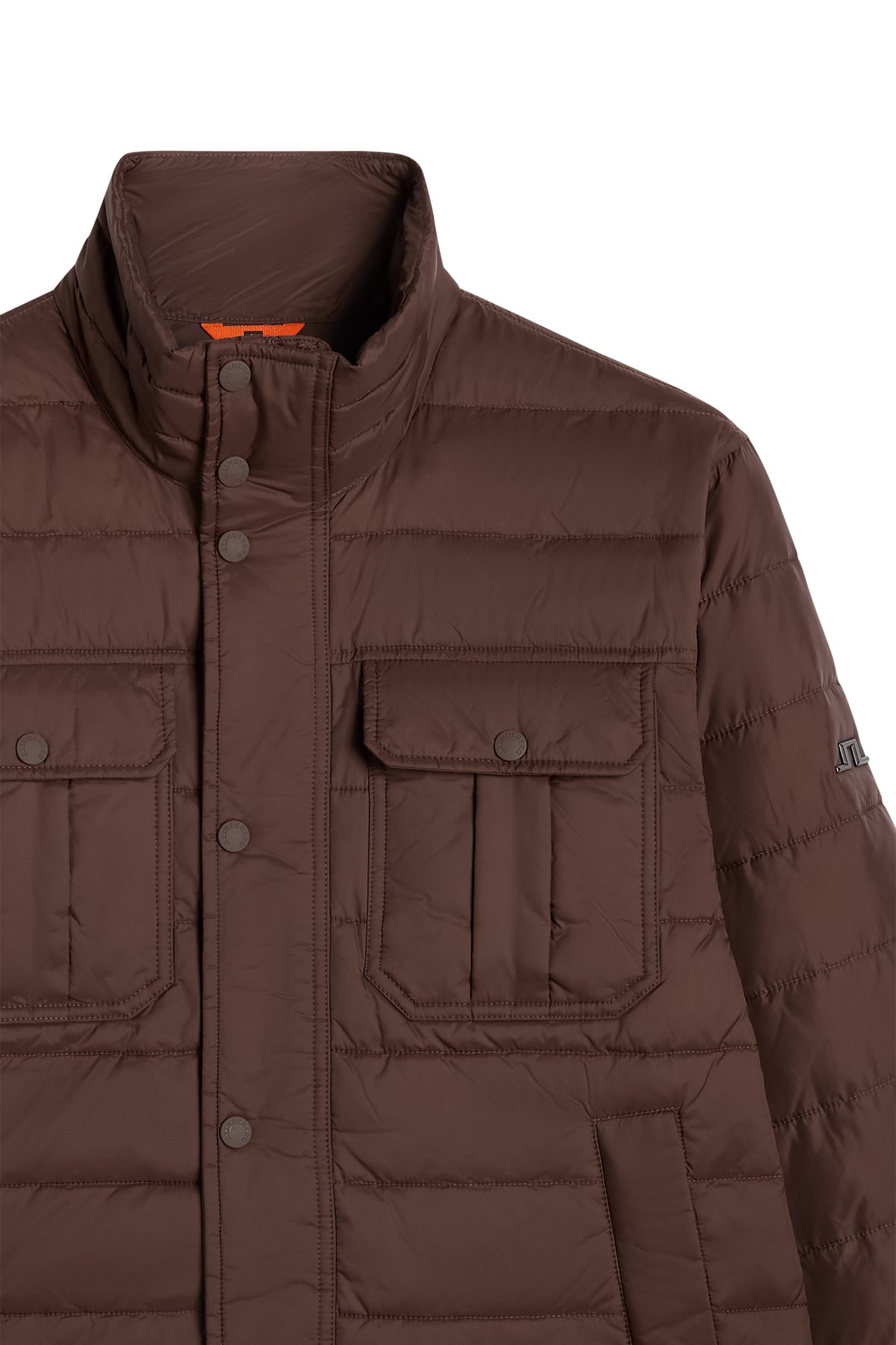Close-up of the Bailey Light Padded Jacket in Seal Brown with flap chest pockets and Bridge logo on the sleeve.
