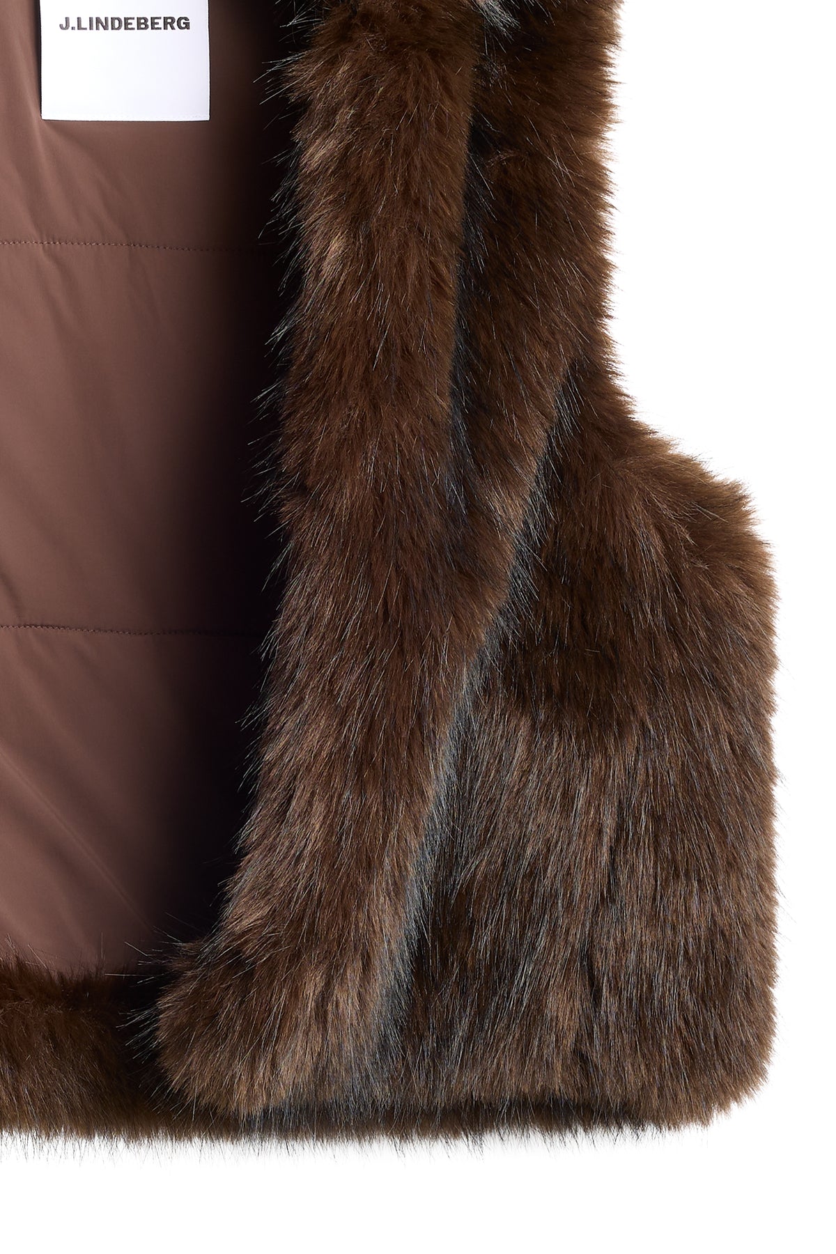 Close-up of the Daria Faux Fur Ball Vest in Seal Brown showing the faux fur texture and interior brand label.
