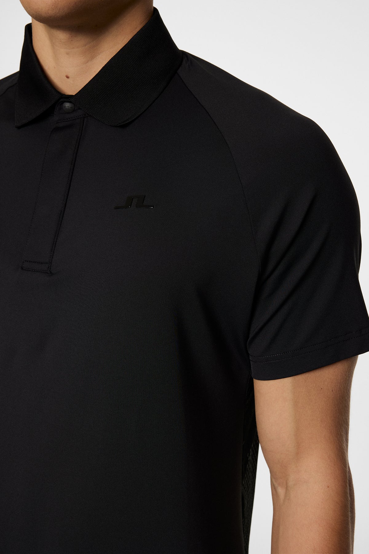 Ray Hybrid Polo in Black by J.Lindeberg