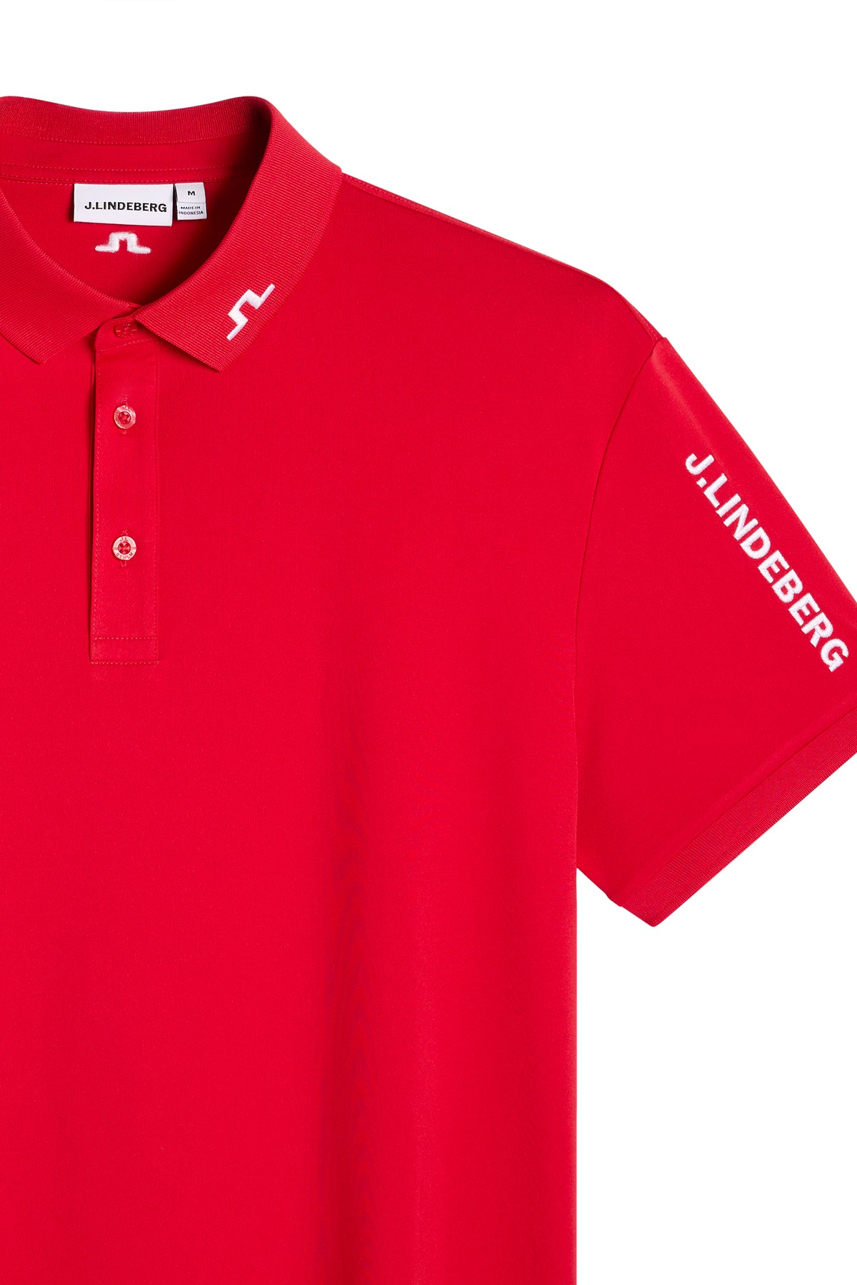 Close-up: Red Tour Tech Polo showing the embroidered Bridge logo on the collar and J.LINDEBERG sleeve logo.