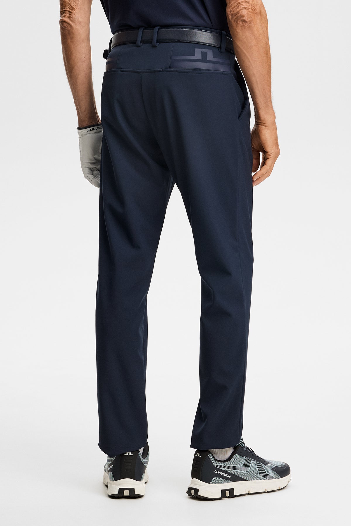 Back view of the Mitch Bonded Players Pant in JL Navy with printed Bridge logo on the back.