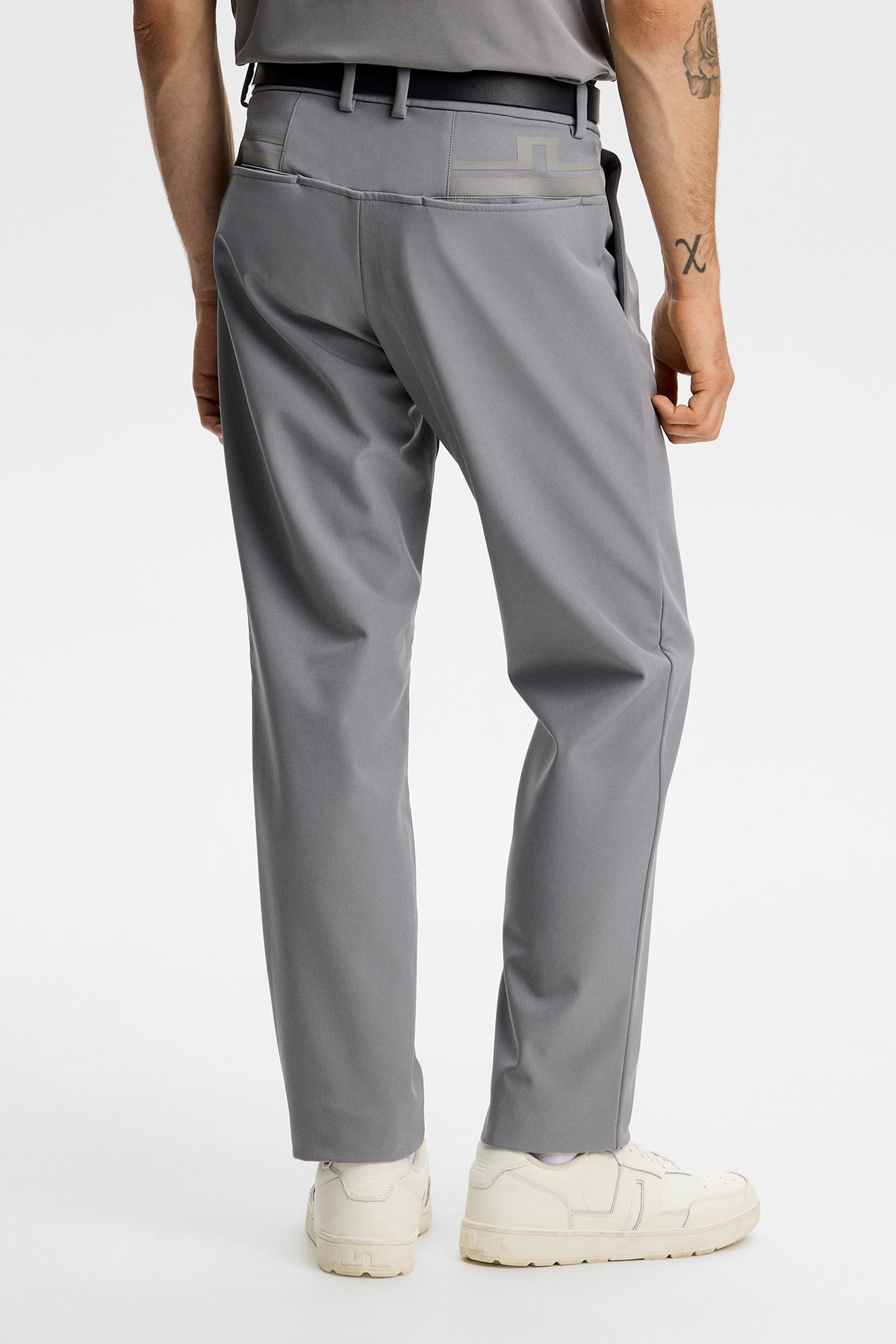 Back view of the Mitch Bonded Players Pant in Night Owl gray, showing rear pockets and Bridge logo detail.