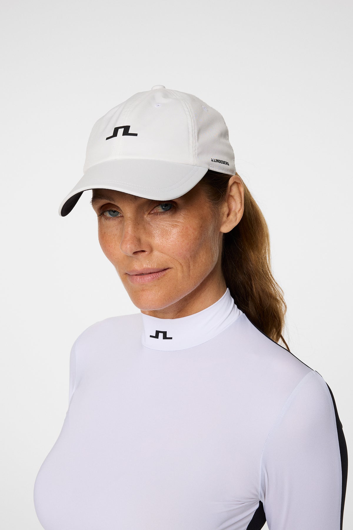 Thea Cap in White by J.Lindeberg