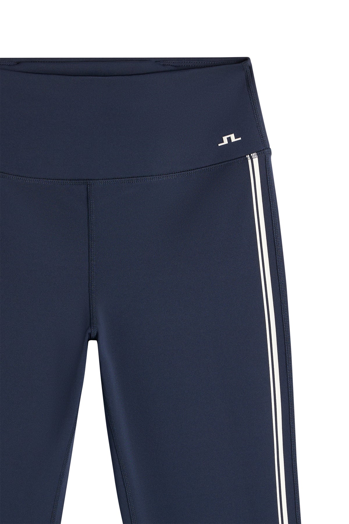 Close-up of the waistband, contrast side stripes, and Bridge logo on the Zienna Flared Leggings in JL Navy.