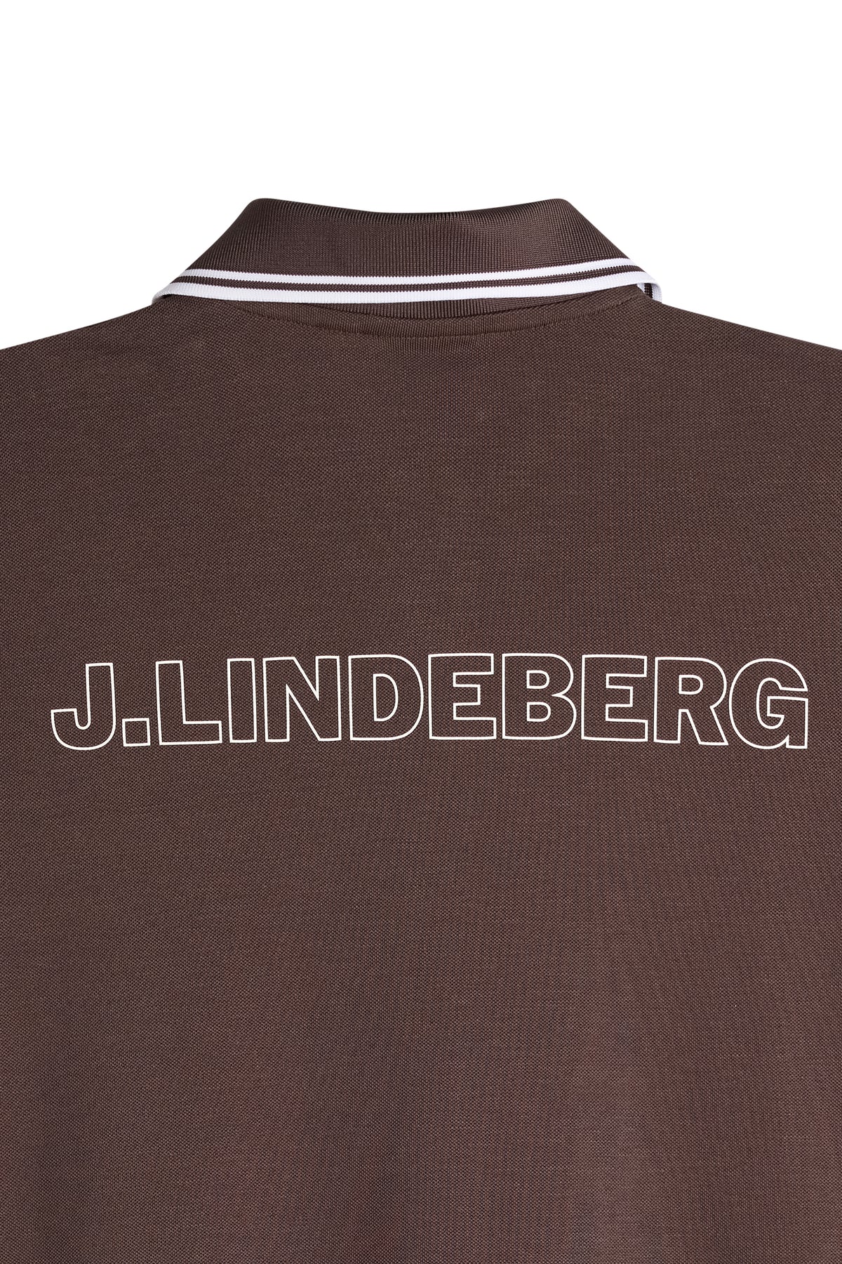 Close-up of the back of the Lacey Dress in brown, showing the white outline J.LINDEBERG script print and tipped polo collar.